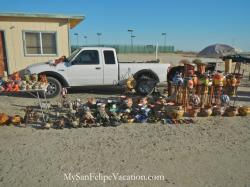 Stacked flower puts for sale at La Cachanilla swap meet